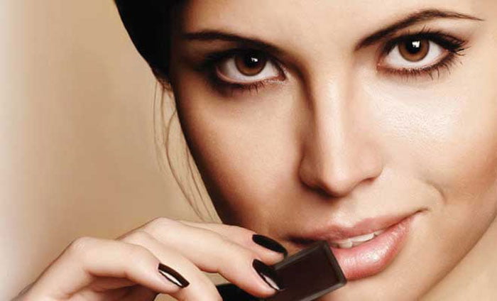 Woman Eating Dark Chocolate