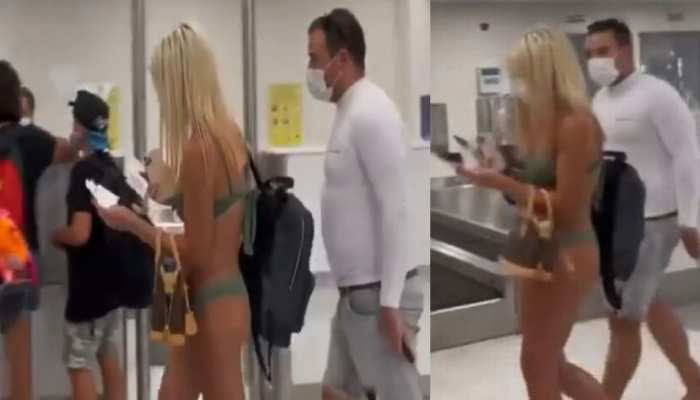 Woman in Bikini & Mask at Miami Airpot : বিকিনি পরেই বিমানবন্দরে ঢুকে পড়লেন তরুণী! চোখ কপালে নেটিজেনদের (দেখুন ভিডিও) - West Bengal News 24